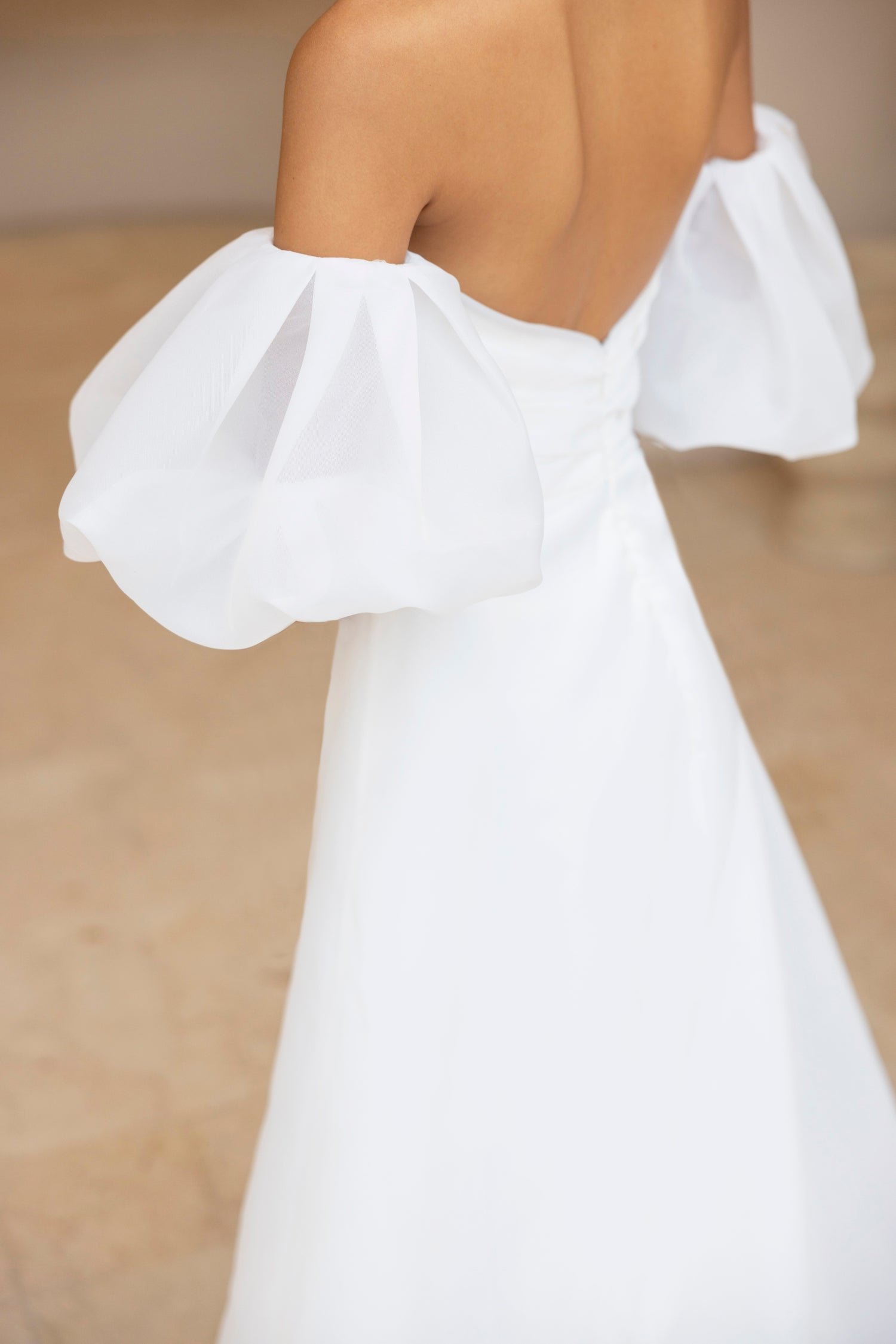 Detail of structured puff sleeve on the Charlie minimalist bridal gown by The Wolf and Lily
