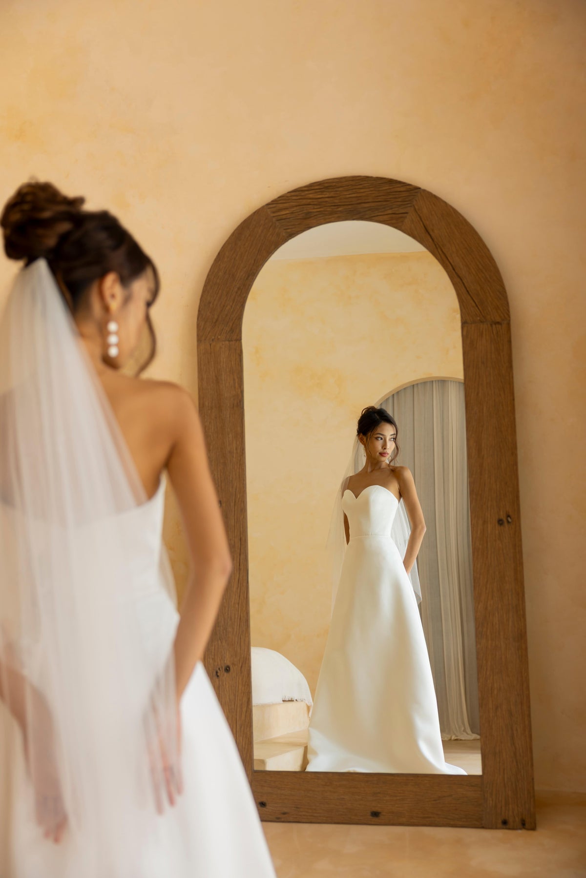 Back view of the Hally strapless sweetheart satin wedding dress by TheWolfandLily
