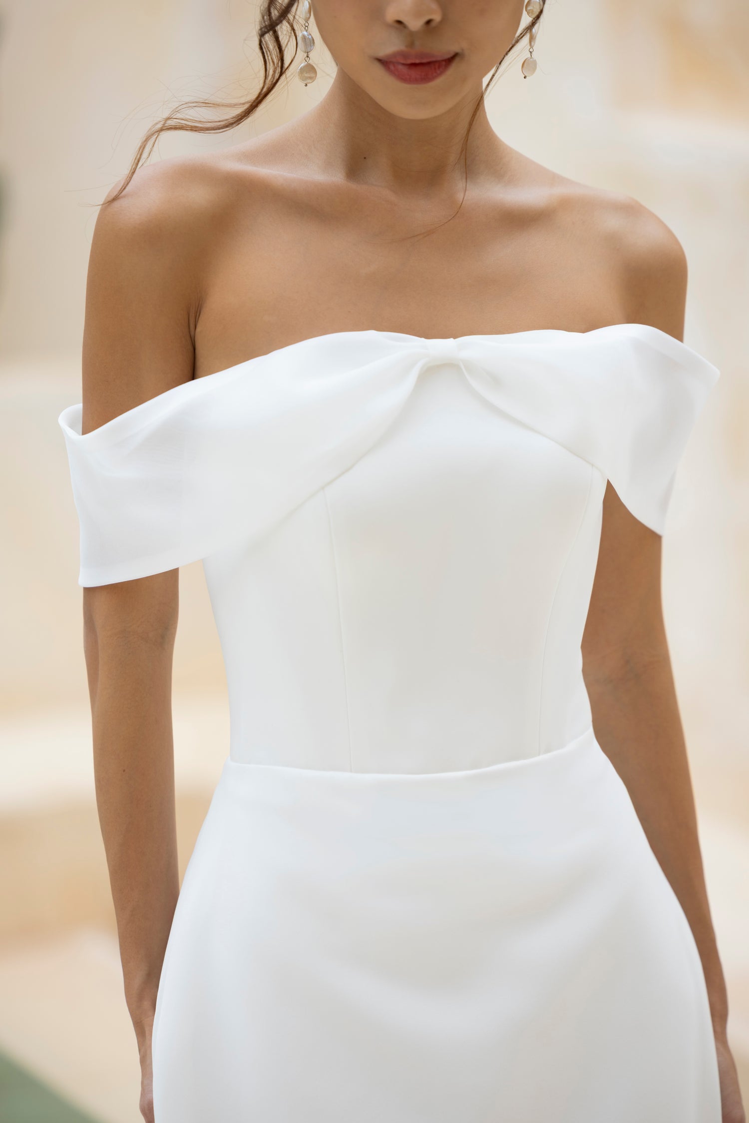 Close-up of Robin dress bodice by TheWolfandLily, featuring soft-structured crepe and organza band