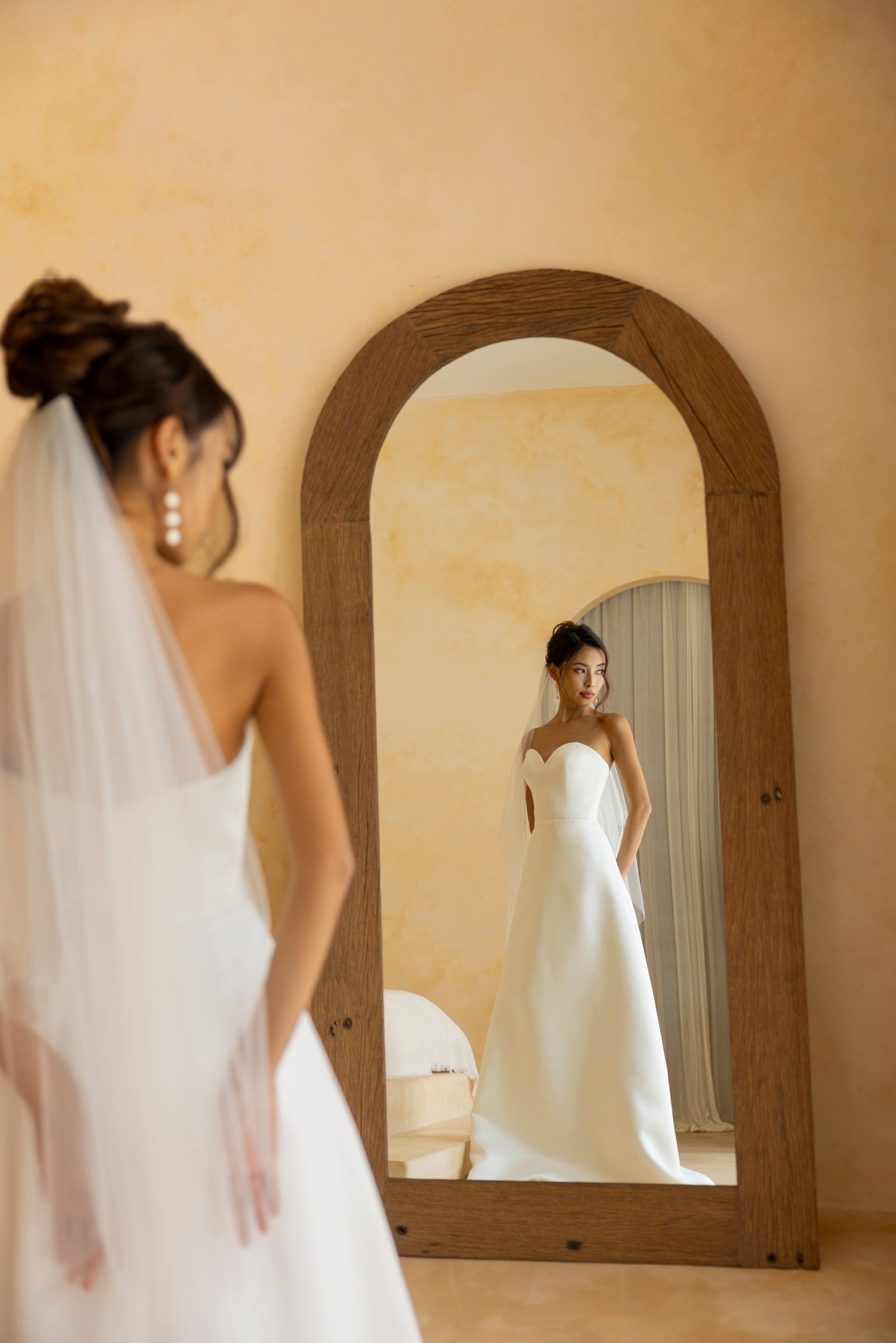 Back view of the Hally strapless sweetheart satin wedding dress by TheWolfandLily